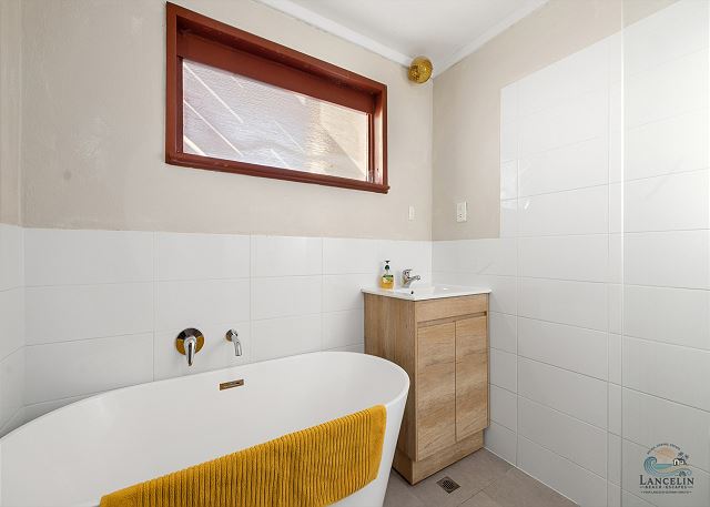 Renovated bathroom with freestanding bath