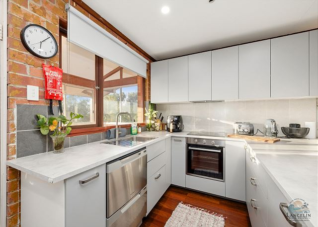 Renovated kitchen with marble bench