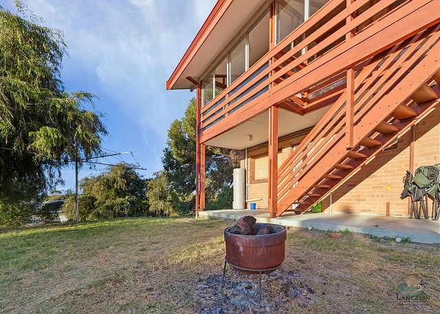 Backyard with fire pit and staircase
