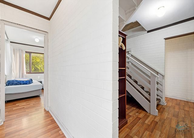 Hallway with bedroom and staircase