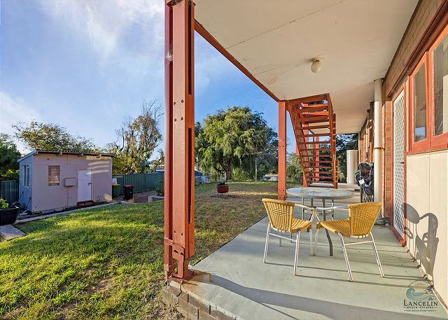 Backyard patio with table and chairs