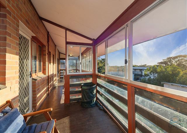 Enclosed verandah with seating and views